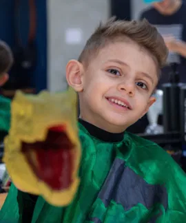 Atendimento infantil na Capitão Barbershop — corte sem choro